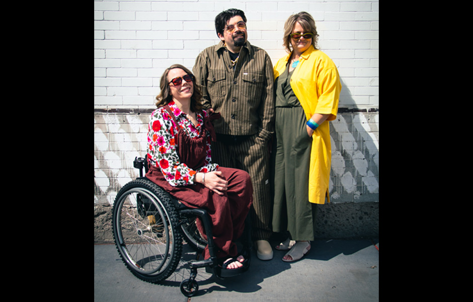 Three individuals dress in clothing from Betty's together
