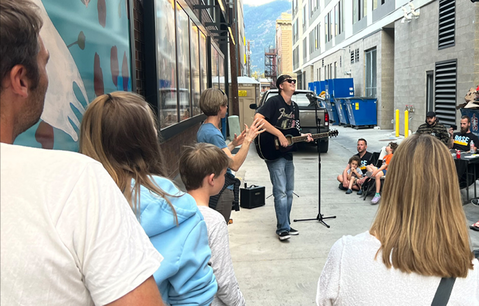 A crowd watches Ethan perform a song