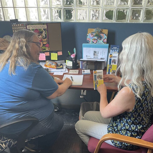 Summit staff member conducting an information and referral with a community member